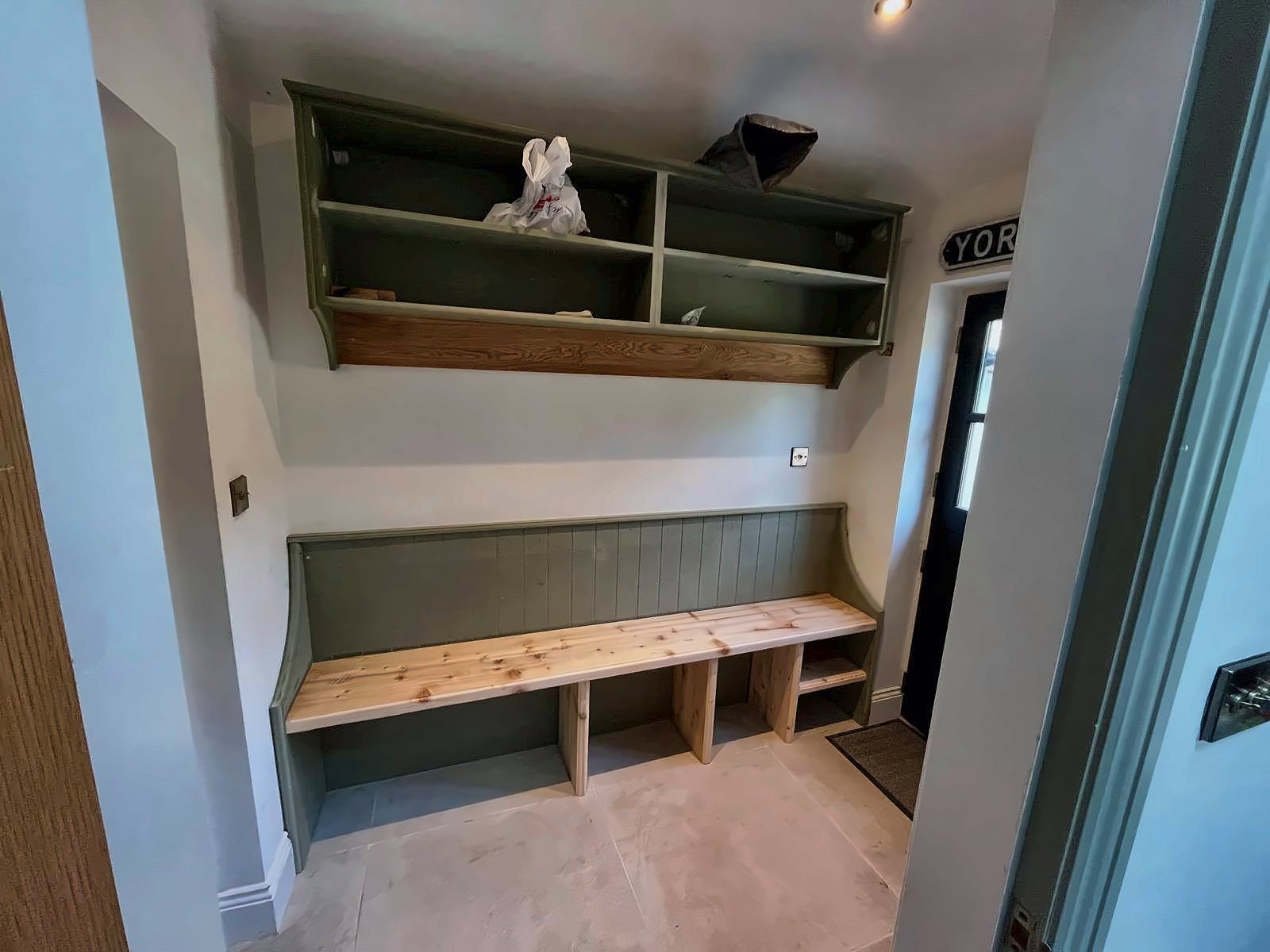 Built-in hallway bench and shelving in progress