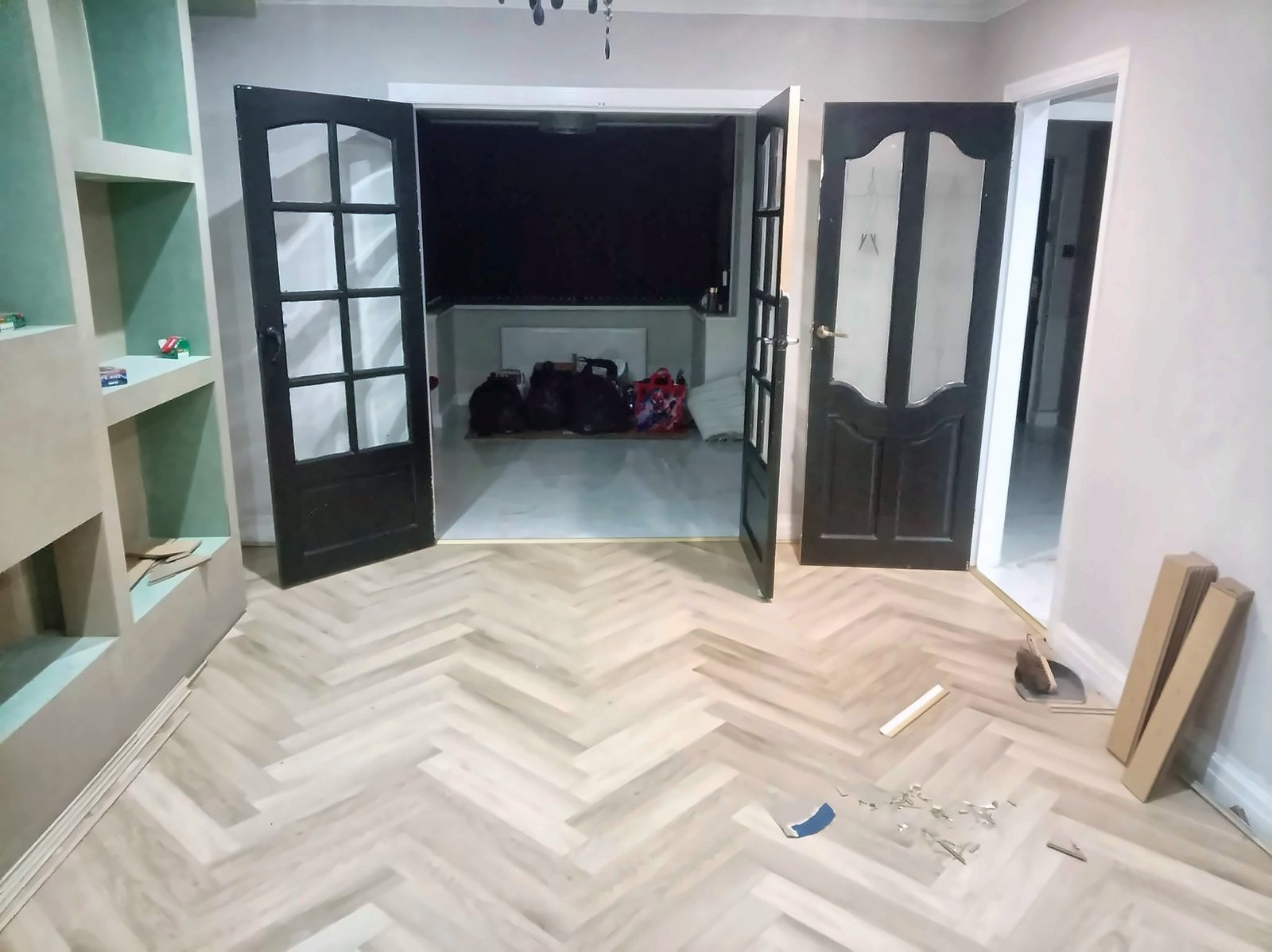 Herringbone floor and black glazed double doors